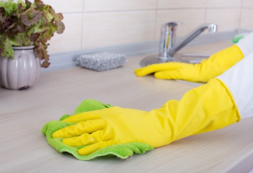 Short-let cleaner preparing a Surrey rental between guest stays