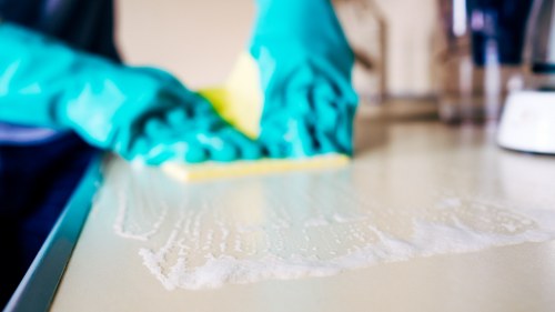 Careful inspection and treatment of curtain fabric during a local cleaning visit